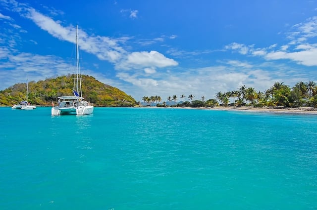 Catamaran on turquoise sea near Mayreau Island, Caribbean Sea