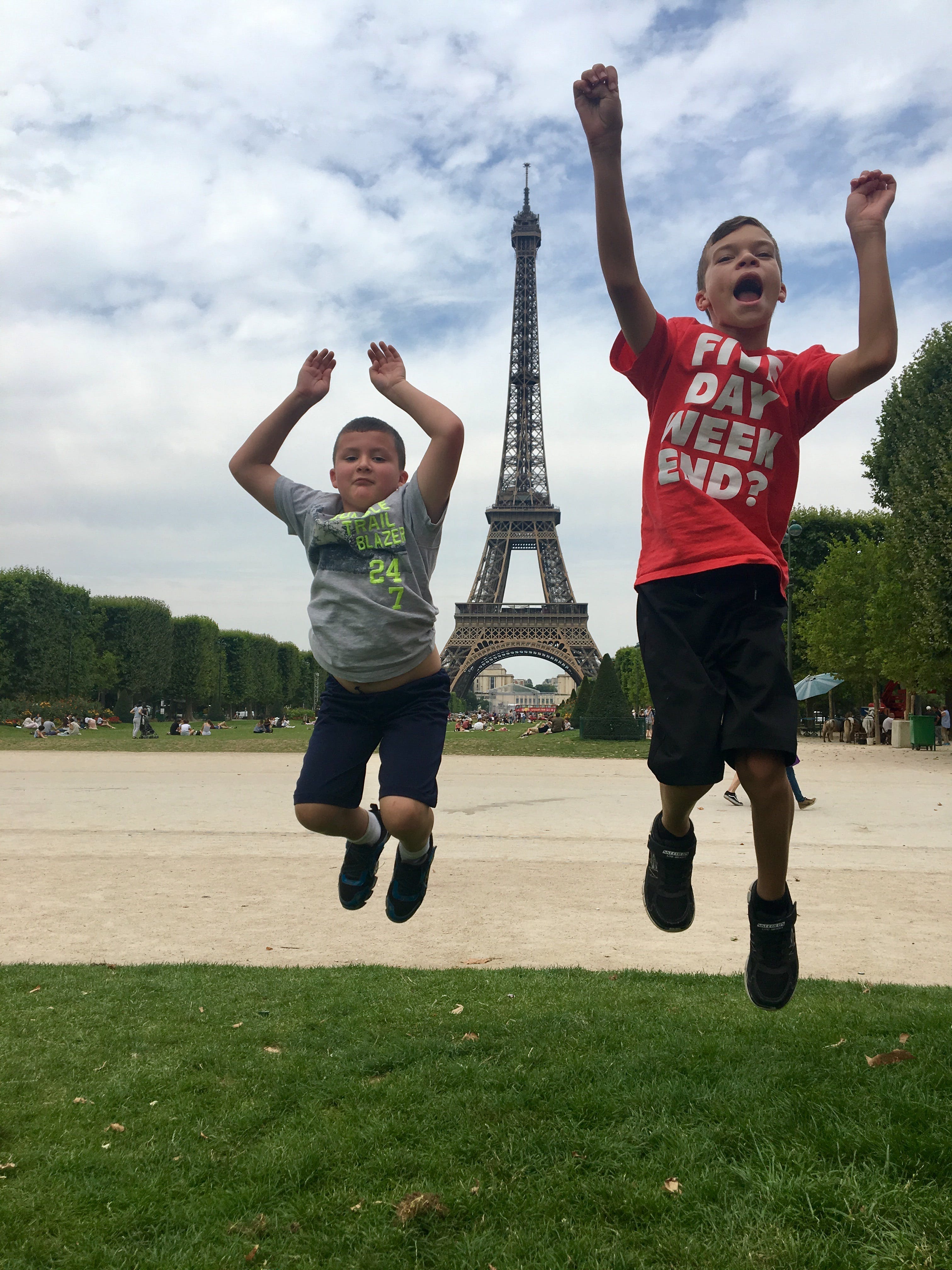 Kids jumping in front of Eiffel Tower
