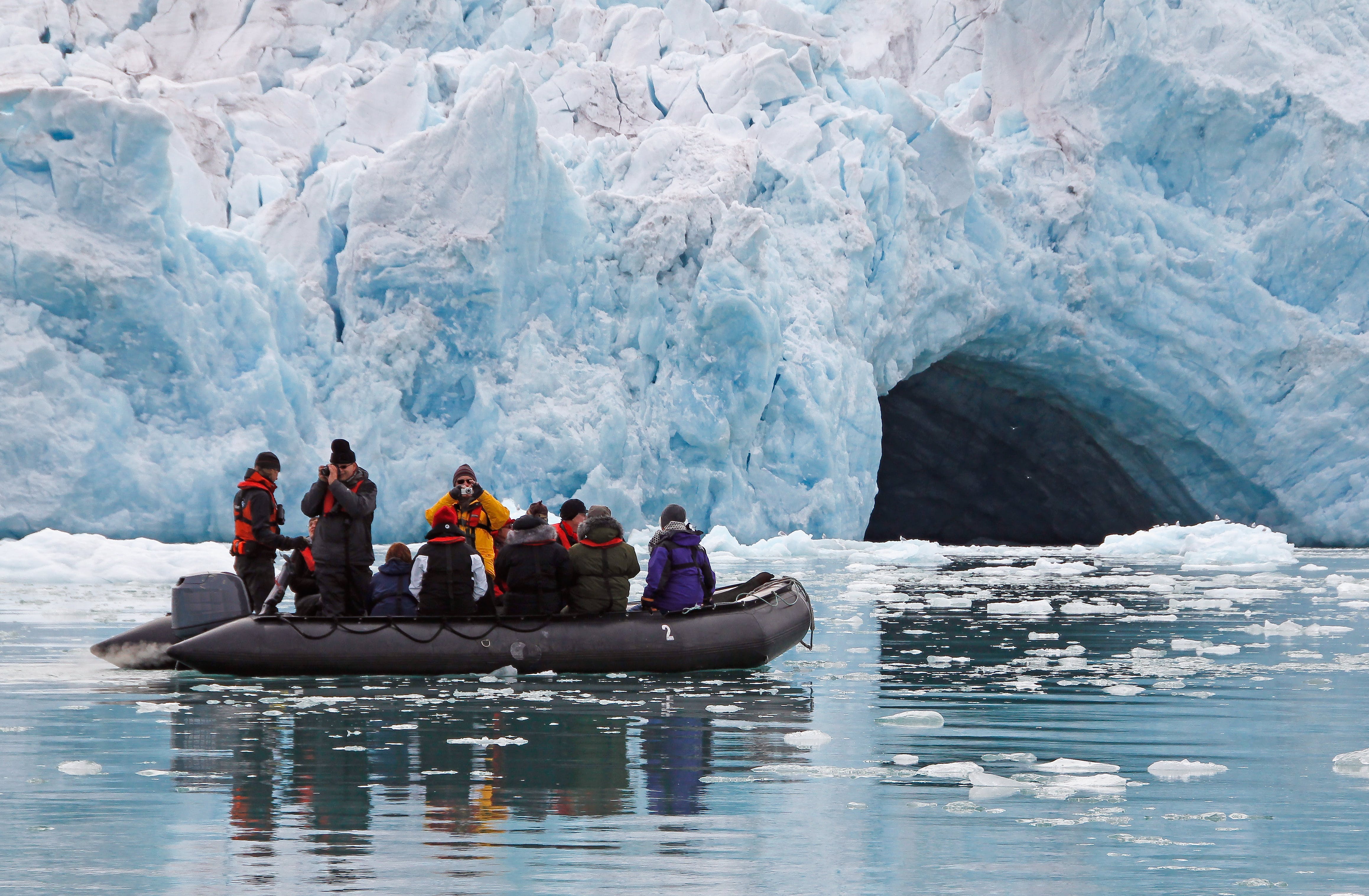 Arctic Zodiac boat near iceberg