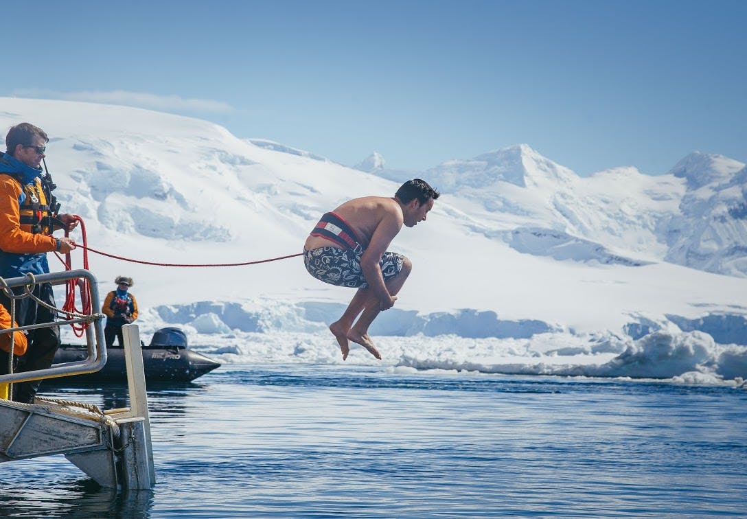 Taking the polar plunge into the freezing water.