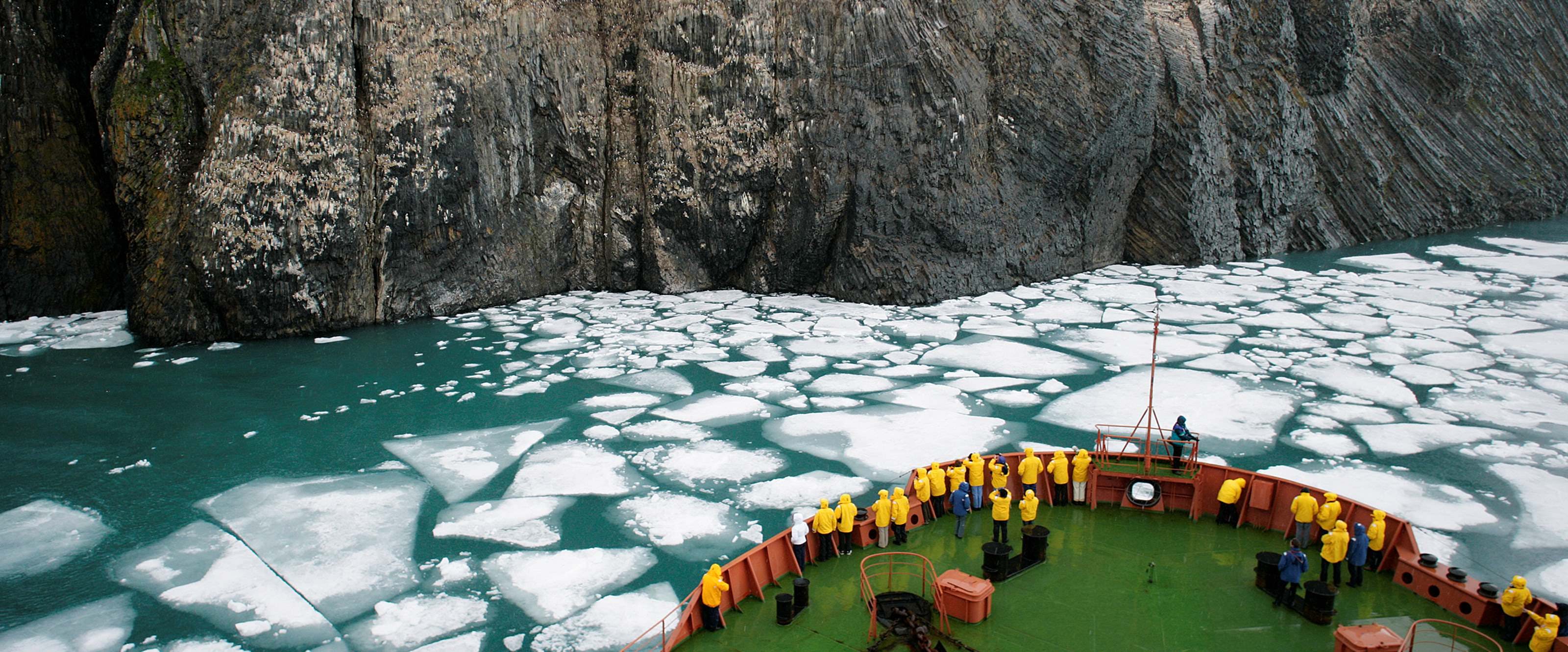 Quark ship in front of glacier