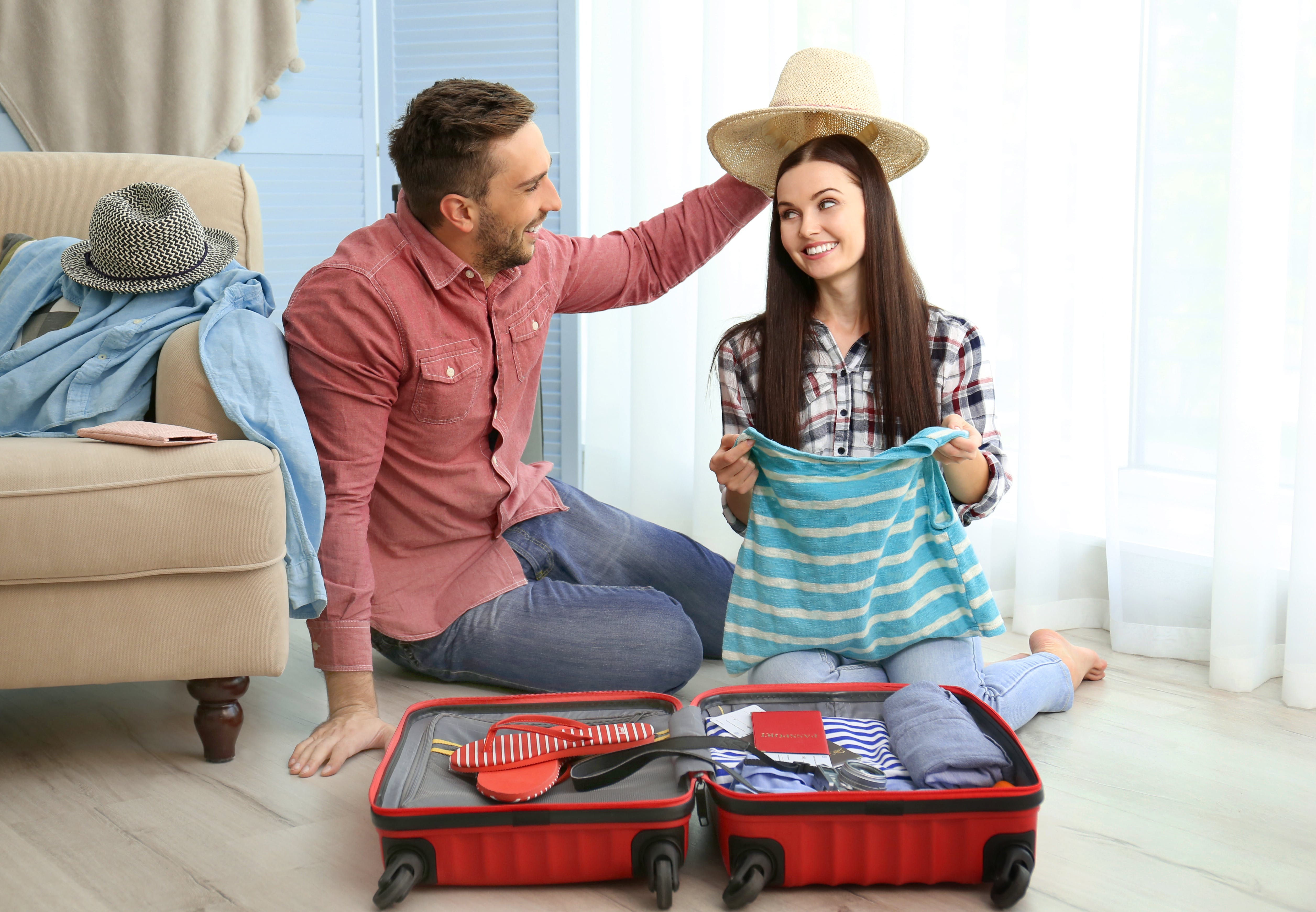 Couple packing for trip