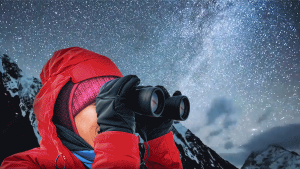 Woman with binoculars stargazing.