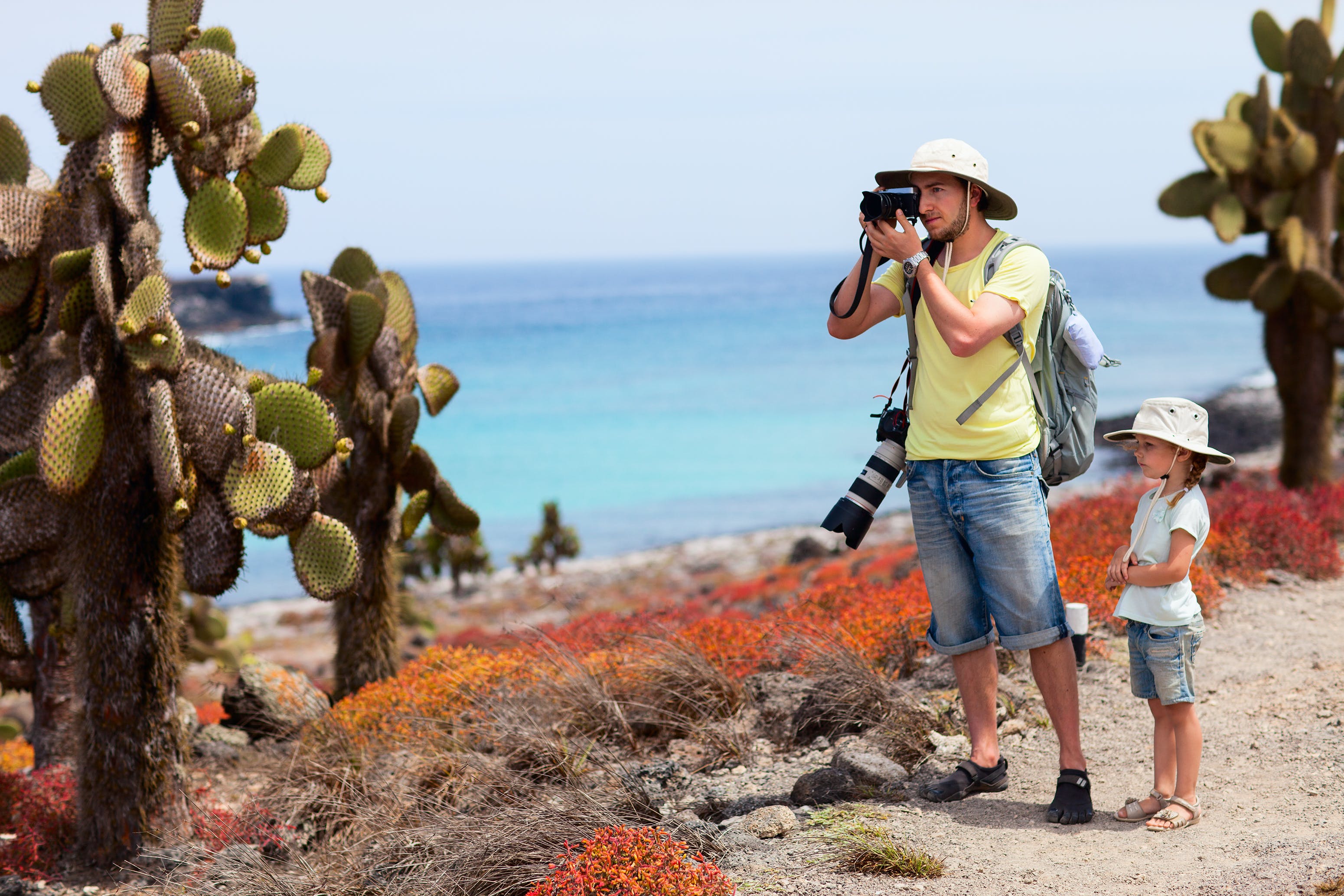 Man taking pictures with daughter