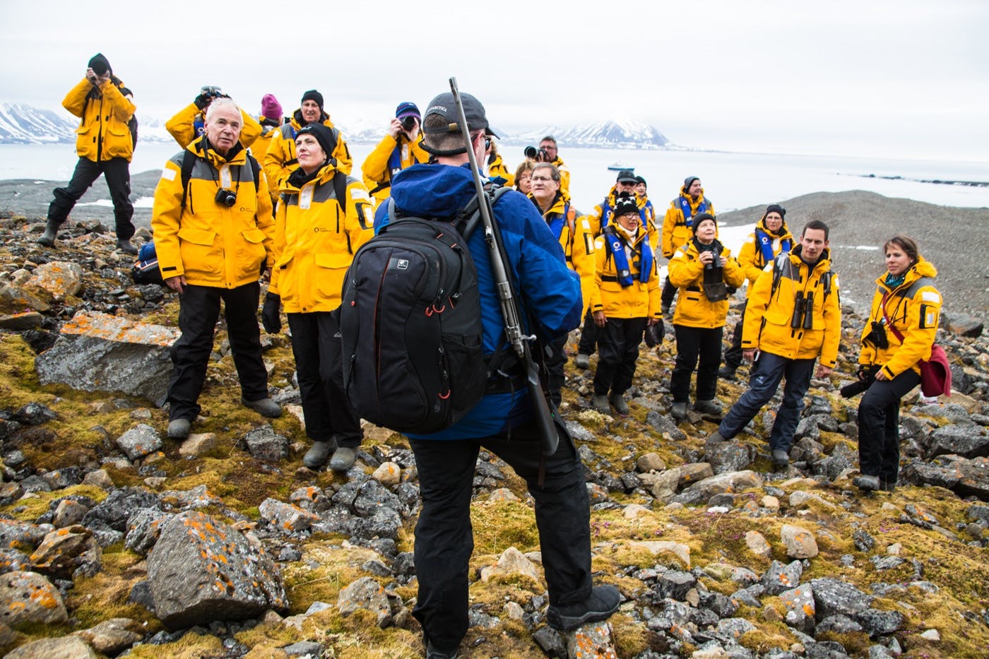 Quark's expedition guide speaking to guests