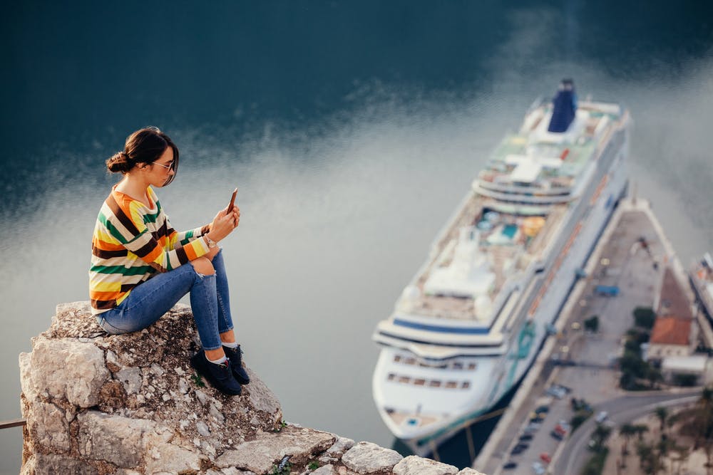 Girl in front of cruise ship