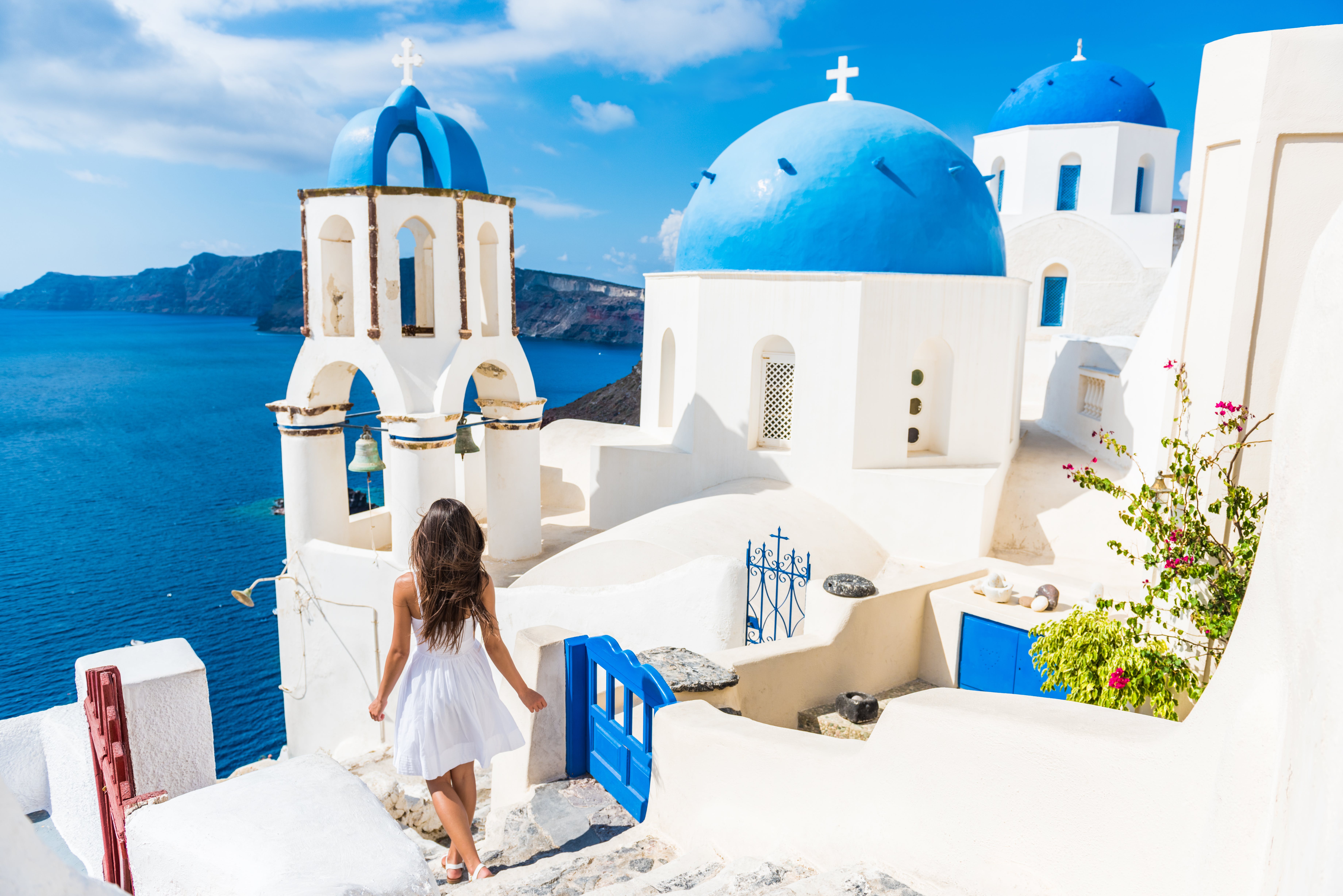 Greek islands, girl walking through town